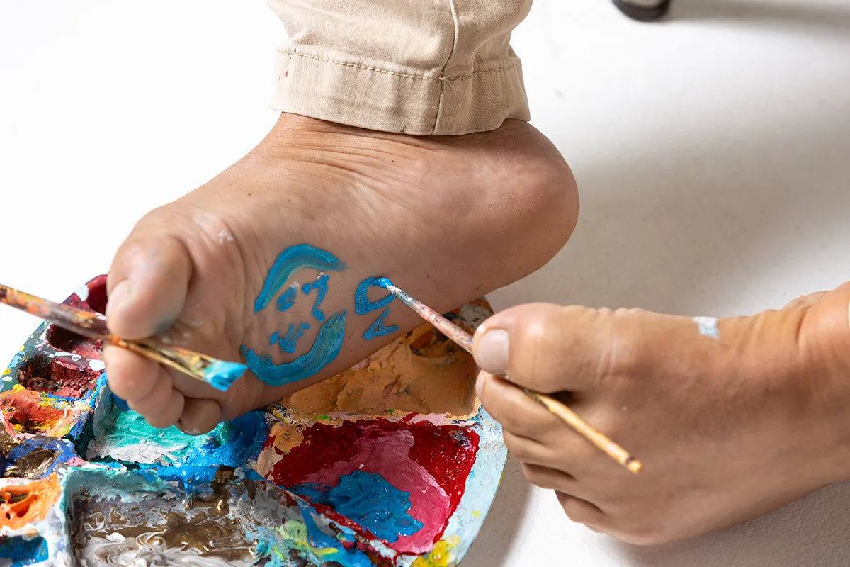 Artista Asociación de Pintores con la Boca y con el Pie